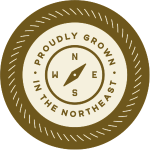 badge reading proudly grown in the northeast
